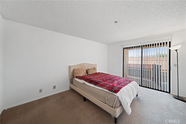 bedroom with carpet floors, access to outside, and a textured ceiling