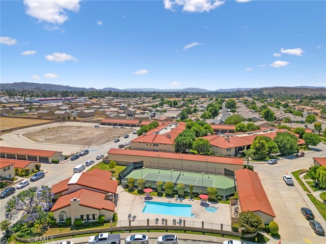 birds eye view of property with a mountain view