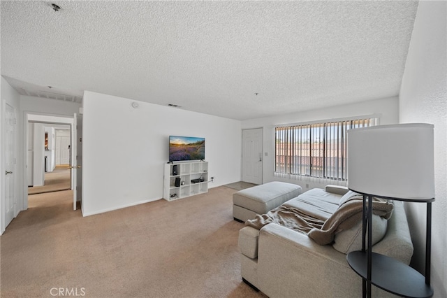 living room with light carpet and a textured ceiling