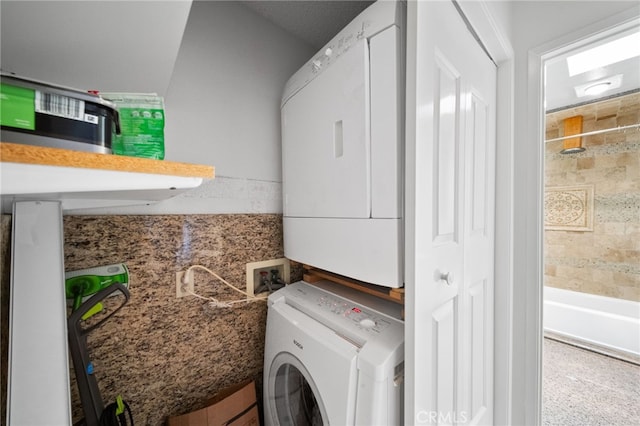 43195 Andrade Ave Unit S, Hemet, CA 92544 - clothes washing area featuring stacked washer and dryer and laundry area