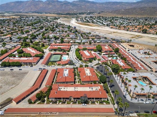 birds eye view of property with a mountain view