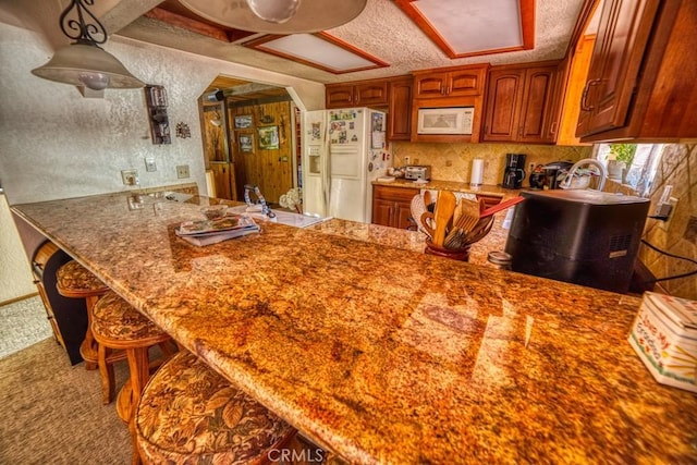 kitchen featuring white appliances and sink