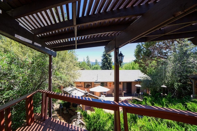 wooden terrace with a pergola