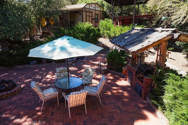 view of patio featuring area for grilling and exterior kitchen