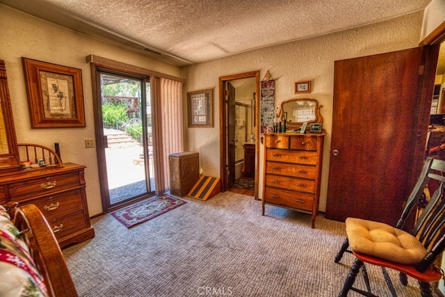 interior space with a textured ceiling and light colored carpet