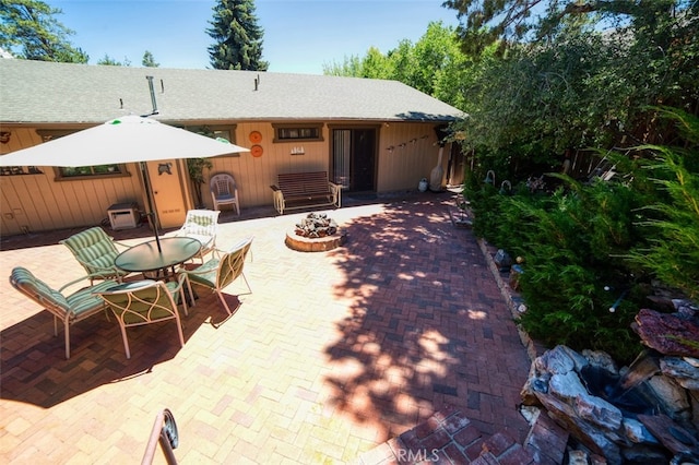 exterior space with a fire pit