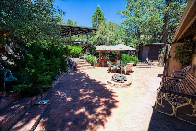 view of patio with a storage shed and a pergola