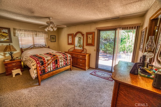 bedroom with access to exterior, a textured ceiling, ceiling fan, and carpet flooring