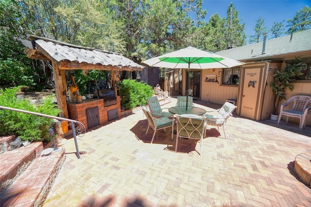 view of patio featuring a gazebo, a grill, and area for grilling