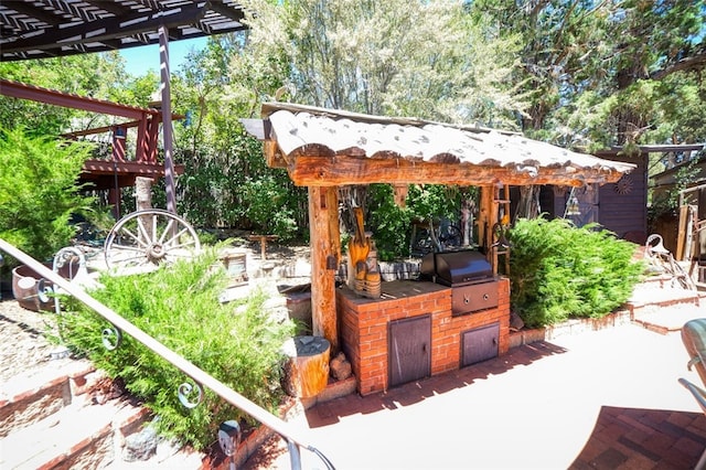 view of patio / terrace with a pergola, area for grilling, and grilling area