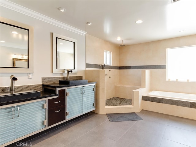 bathroom with tile patterned flooring, plenty of natural light, vanity, and separate shower and tub