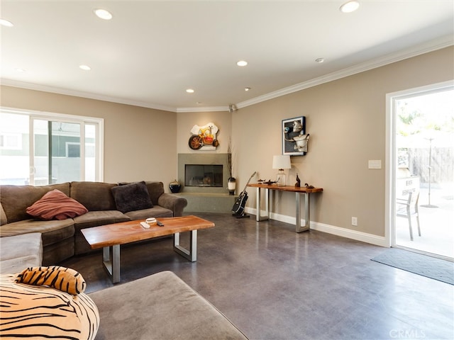 living room featuring crown molding and a healthy amount of sunlight