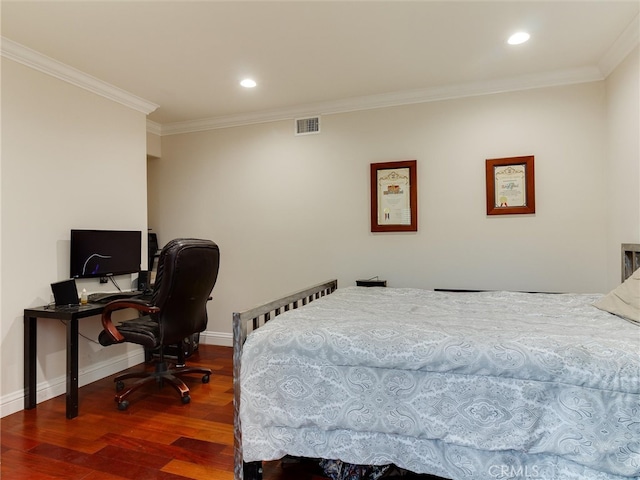 bedroom with crown molding and hardwood / wood-style floors