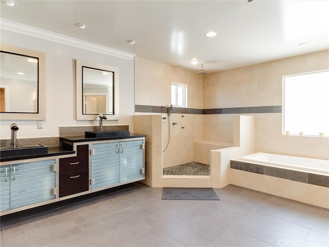 bathroom with crown molding, shower with separate bathtub, vanity, and tile patterned floors