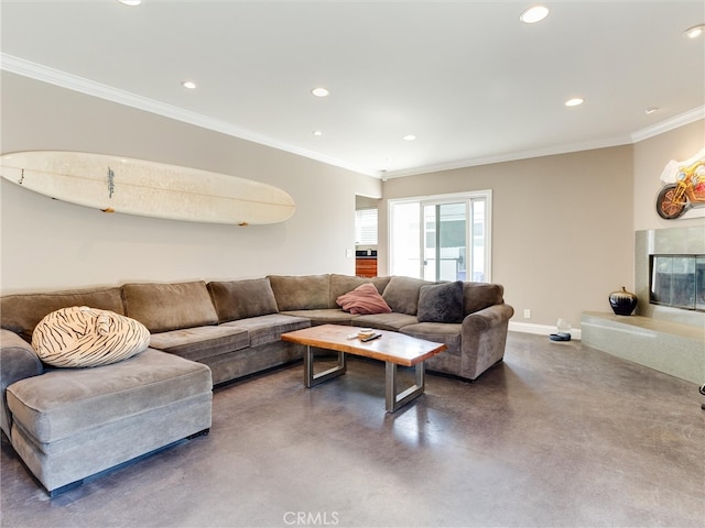 living room featuring ornamental molding and concrete flooring