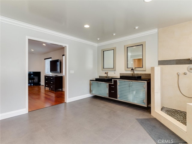 interior space featuring a shower, crown molding, hardwood / wood-style floors, and vanity