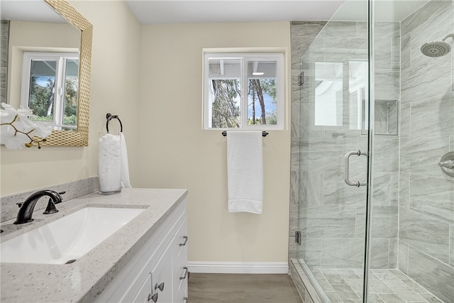 bathroom featuring vanity and walk in shower