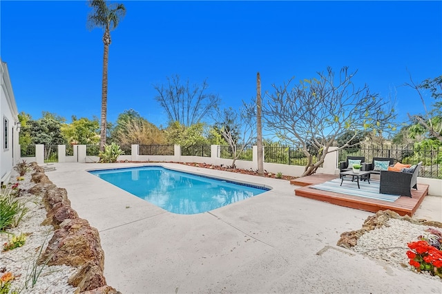 view of pool featuring a wooden deck