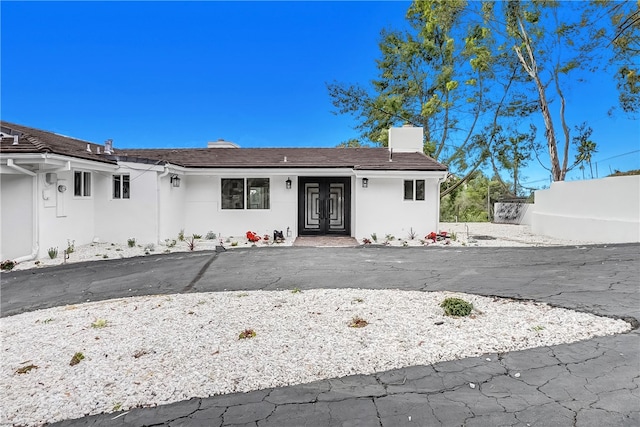 single story home featuring french doors