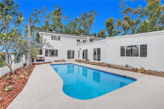 back of house with a patio