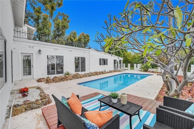 view of pool featuring a wooden deck