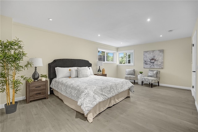 bedroom with light hardwood / wood-style floors