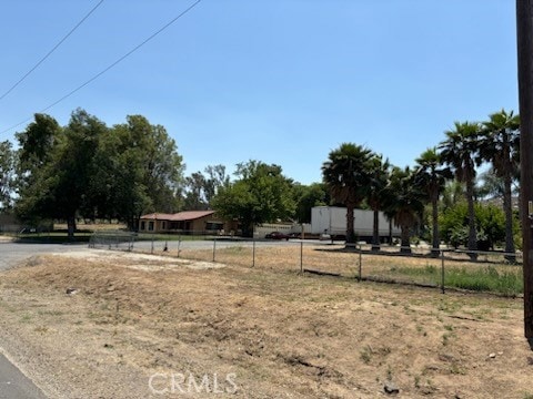 view of yard with a rural view