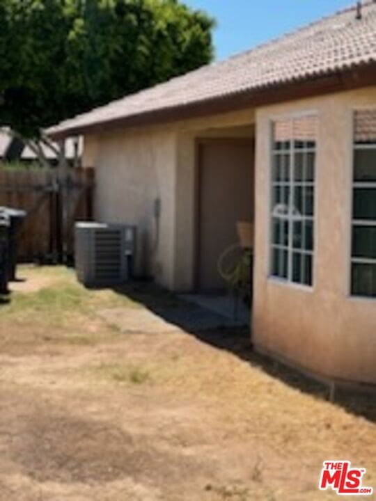 view of property exterior with central air condition unit