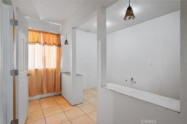 bathroom with tile patterned floors