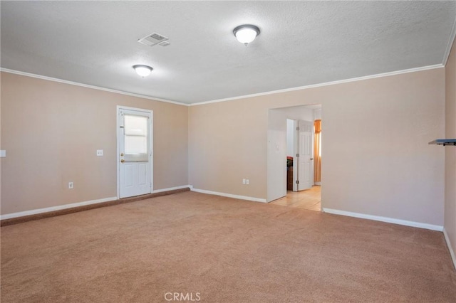 unfurnished room with ornamental molding, light colored carpet, and baseboards