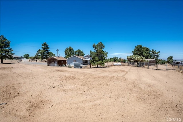 view of yard with a rural view