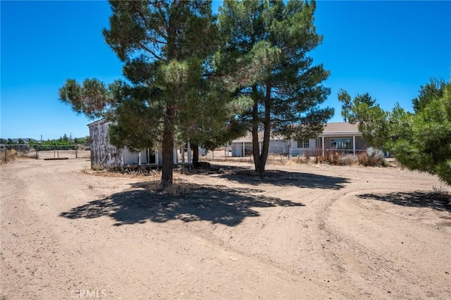 view of property hidden behind natural elements