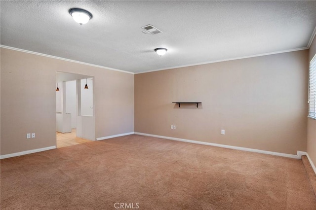 carpeted empty room featuring a textured ceiling and ornamental molding