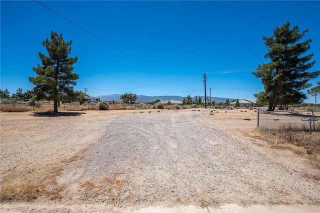 view of road with a mountain view and a rural view