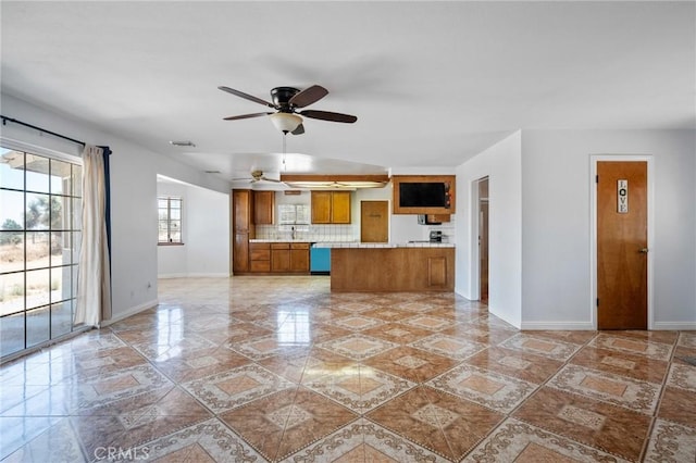 kitchen with backsplash, ceiling fan, and dishwasher