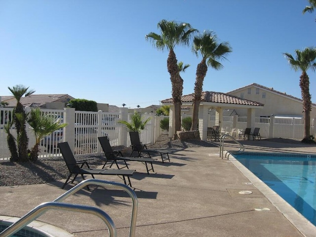 view of swimming pool featuring a patio