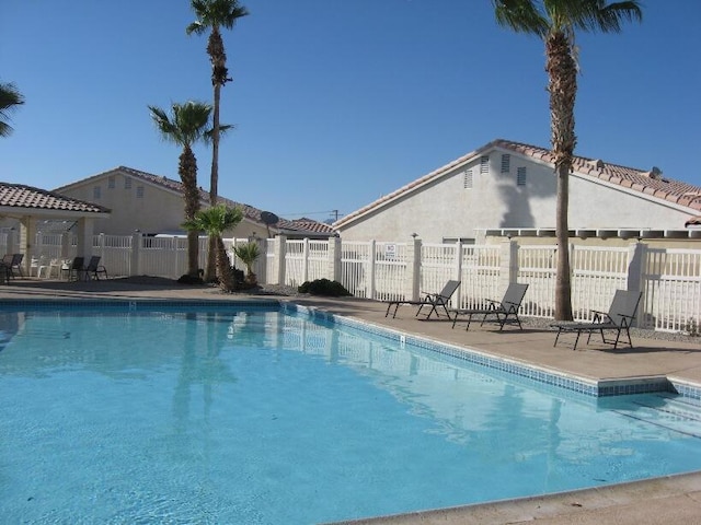 view of swimming pool with a patio area