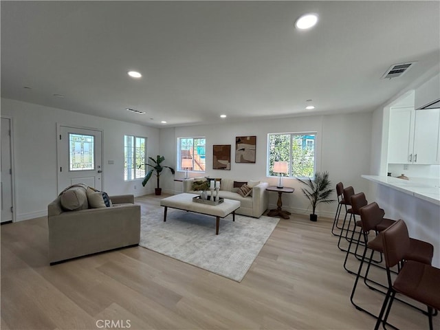 living room with light hardwood / wood-style flooring