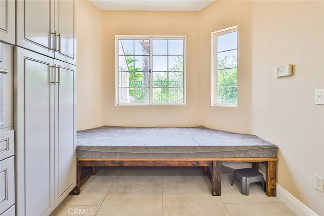 mudroom with tile patterned flooring and plenty of natural light