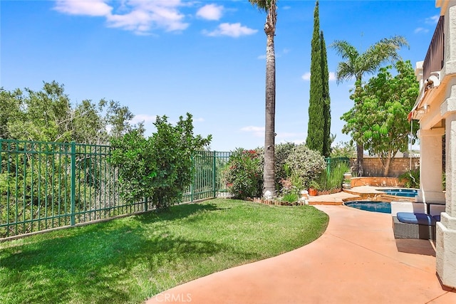 view of yard featuring a patio area and a fenced in pool