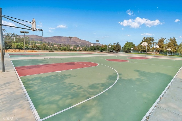 view of basketball court with a mountain view