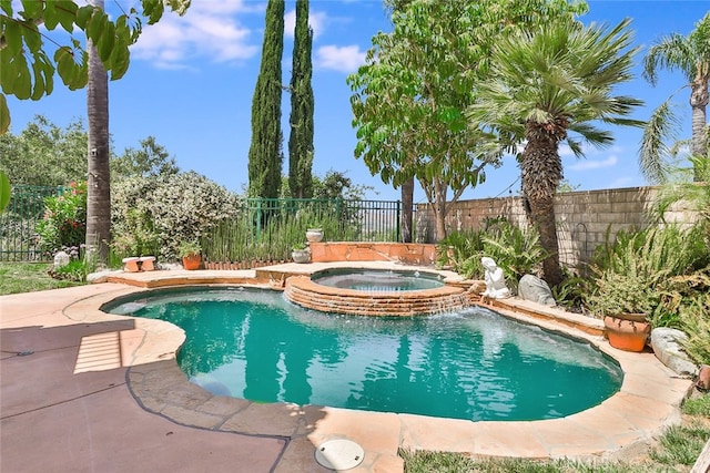 view of swimming pool with an in ground hot tub and pool water feature