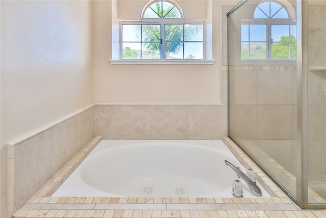 bathroom with tiled tub