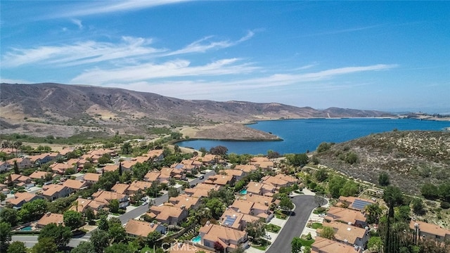 bird's eye view with a water and mountain view