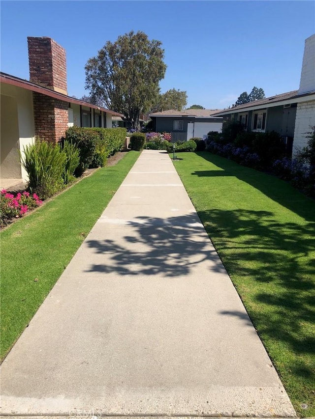 view of community featuring a lawn