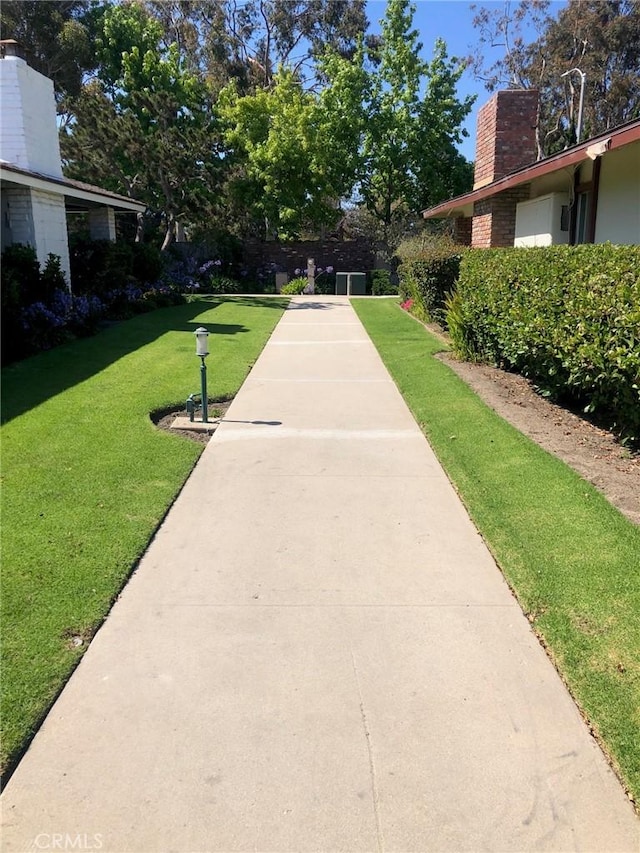 view of home's community featuring a yard