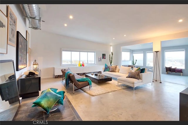 living room featuring concrete flooring