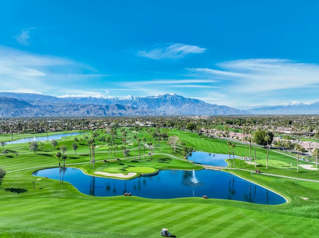 exterior space with a water and mountain view