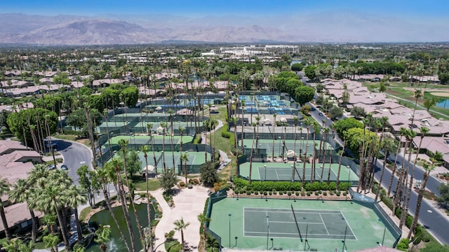 birds eye view of property with a mountain view