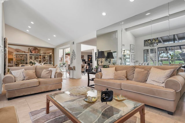 tiled living room with a notable chandelier and high vaulted ceiling